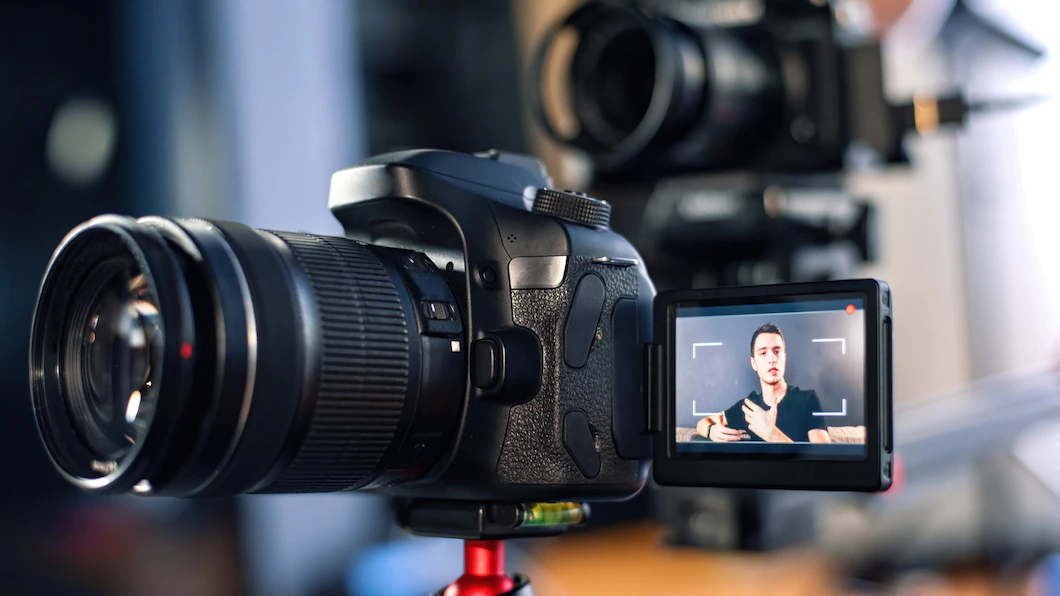 man-talking-camera-recording-himself-vlog-working-from-home-young-content-creator-multiple-cameras_1268-17416